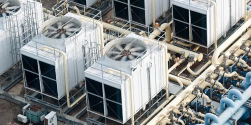 Aerial shot of rooftop fans on top of commercial building